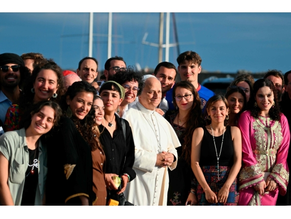 Pope Leo XIV poses with the crew of the Peace training ship 