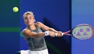 Italy's Jasmine Paolini hits a return to Kazakhstan's Elena Rybakina during their women痴 singles semi-final match at the WTA Ningbo Open tennis tournamen in Ningbo, China, eastern Zhejiang province on October 18, 2025. (Photo by AFP)