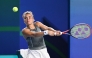 Italy's Jasmine Paolini hits a return to Kazakhstan's Elena Rybakina during their women痴 singles semi-final match at the WTA Ningbo Open tennis tournamen in Ningbo, China, eastern Zhejiang province on October 18, 2025. (Photo by AFP)