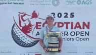 Daniil Sokolov celebrates with the trophy.
