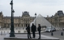 French police officers stand in front of the Louvre Museum after robbery, in Paris on October 19, 2025. Photo by DIMITAR DILKOFF / AFP