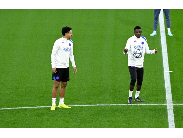 Paris Saint-Germain’s Ousmane Dembele (right) and Marquinhos attend a training session