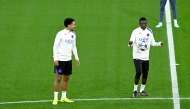 Paris Saint-Germain’s Ousmane Dembele (right) and Marquinhos attend a training session