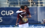 Qatar's Mohammed Saadon Al Kuwari (right) celebrates with a teammate