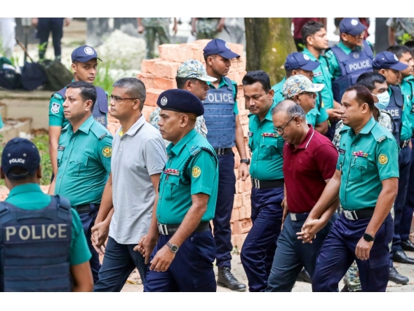 Police personnel escort detained army officers to the International Crimes Tribunal court in Dhaka on 22 October 2025. Photo by AFP