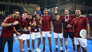 Qatar players and officials celebrate after qualifying for the final.