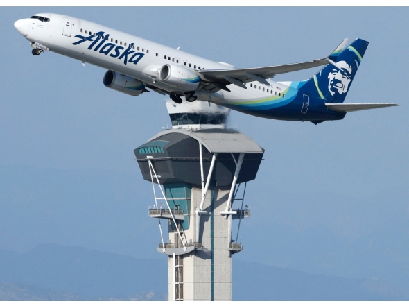 An Alaska Airlines plane takes off near the air traffic control tower at Los Angeles International Airport on October 22, 2025 in Los Angeles, California. Photo by MARIO TAMA / GETTY IMAGES NORTH AMERICA / Getty Images via AFP