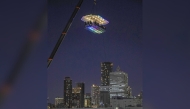 An aerial restaurant in Japan suspended by a crane. (Photo by The Japan News)

