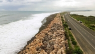 Storm surge crashes into the seawall that protects Palisadoes Strip, the route to Norman Manley International Airport, before the arrival of Hurricane Melissa, in Kingston, Jamaica, on October 25, 2025. Photo by Ricardo Makyn / AFP