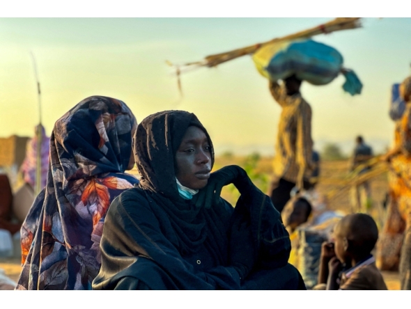 A displaced woman rests in Tawila, in the country's war-torn western Darfur region, on October 28, 2025, after fleeing El-Fasher following the city's fall to the Rapid Support Forces (RSF). (Photo by AFP)
 