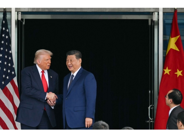 US President Donald Trump (L) and China's President Xi Jinping shake hands as they leave after their talks at the Gimhae Air Base on October 30, 2025. (Photo by Andrew Caballero-Reynolds / AFP)
 