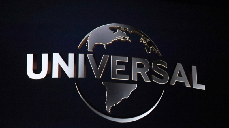The Universal logo is displayed on a screen during a Universal Studios special presentation during CinemaCon 2022 at Caesars Palace in Las Vegas, Nevada, on April 27, 2022. (Photo by Valerie Macon / AFP)
