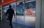 A 'We Accept Food Stamps' sign hangs in the window of a grocery store on October 31, 2025 in Miami, Florida. (Photo by Joe Raedle / Getty Images via AFP)