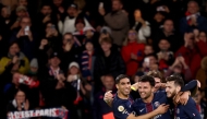 Paris Saint-Germain's Portuguese forward #09 Goncalo Ramos (C) celebrates scoring his team's first goal with Paris Saint-Germain's Moroccan defender #02 Achraf Hakimi (L) and Paris Saint-Germain's Georgian forward #07 Khvicha Kvaratskhelia (R) during the French L1 football match between Paris Saint-Germain (PSG) and OGC Nice at the Parc des Princes stadium in Paris on November 1, 2025. (Photo by FRANCK FIFE / AFP)