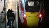 Police officers work on the platform alongside an LNER Azuma train at Huntingdon Station in Huntingdon, eastern England, on November 1, 2025, following a stabbing on a train. Photo by JUSTIN TALLIS / AFP