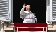 Pope Leo XIV waves to the crowd from the window of the apostolic palace overlooking St. Peter's square in The Vatican on November 2, 2025. (Photo by Andreas Solaro / AFP)

