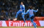 India's Shafali Verma (L) celebrates with her team captain Harmanpreet Kaur after taking the wicket of South Africa's Marizanne Kapp at the DY Patil Stadium in Navi Mumbai on November 2, 2025. (Photo by Punit Paranjpe / AFP)