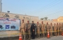 Security personnel waiting in line to vote in Iraq