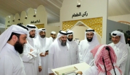 Undersecretary of the Ministry of Awqaf and Islamic Affairs H E Dr. Sheikh Khalid bin Mohammed bin Ghanem Al-Thani during a tour of the exhibition. 