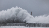 Strong waves crash against the sea wall in Yilan on November 11, 2025, as Typhoon Fung-Wong approaches. (Photo by I-Hwa Cheng / AFP)