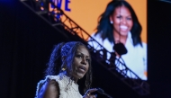 Former first lady Michelle Obama addresses the crowd at the When We All Vote Rally outside Atlanta, a campaign appearance stumping for Vice President Kamala Harris last year. Jahi Chikwendiu/The Washington Post