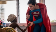 Leonardo Muylaert, known as the Brazilian Superman, greets a patient during a visit at the Korle Bu Teaching Hospital in Accra. (Photo by Claudia Lacave / AFP)