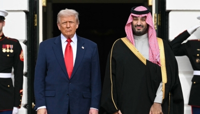 US President Donald Trump greets Crown Prince and Prime Minister of the Kingdom of Saudi Arabia Mohammed bin Salman on the South Lawn at the White House in Washington, DC on November 18, 2025. Photo by Saul Loeb / AFP