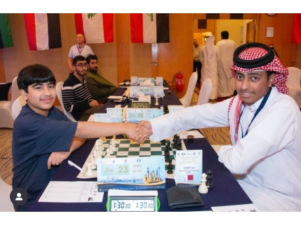 Qatar's Hamad Al Kuwari (right) shakes hand with Kuwait's Hussein Suleiman before the start of their second round match.