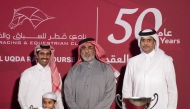 Sheikh Mohammed bin Faleh Al Thani handed the trophy to Aafoor’s trainer, M.H.K. Al Attiyah, who received it on behalf of Al Jeryan Stud. QREC Chairman Hamad bin Abdulrahman Al Attiya was also present. PICTURES: JUHAIM/QREC