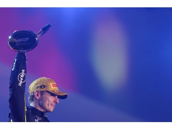 Race winner Max Verstappen of the Netherlands and Oracle Red Bull Racing lifts his trophy on the podium during the F1 Grand Prix of Las Vegas at Las Vegas Strip Circuit on November 22, 2025 in Las Vegas, Nevada. Hector Vivas/Getty Images/AFP