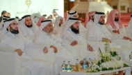 Minister of Awqaf and Islamic Affairs H E Ghanem bin Shaheen bin Ghanem Al Ghanim with other officials during the Holy Quran competition.