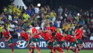 Portugal players celebrate after winning the penalty shoot out against Brazil.