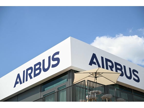(FILES) The logo of Aerospace company Airbus is displayed at the Pavillon Airbus during the 55th edition of the International Paris Air Show at the Paris Bourget Airport, in Le Bourget, suburb of Paris on June 17, 2025. (Photo by Bertrand GUAY / AFP)