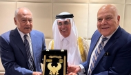 Secretary-general of the Arab League Ahmed Aboul Gheit (left) along with another official honouring Minister of State and President of Qatar National Library H E Dr. Hamad bin Abdulaziz Al-Kawari (centre) during the forum.