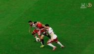 Egypt's Marwan Hamdy (centre) is challenged by two UAE players.