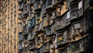The Hou Kong residential building is seen in Macau on December 8, 2025. Macau's population is estimated around 710,000 across roughly 33 square kilometres, making it the world's most densely populated region. (Photo by Eduardo Leal / AFP)