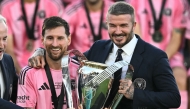 File photo of Inter Miami's Argentine forward #10 Lionel Messi (L) poses with the trophy next to the team's owner David Beckham (R) after winning the Major League Soccer (MLS) Cup final between Inter Miami and the Vancouver Whitecaps at Chase Stadium in Fort Lauderdale, Florida, on December 6, 2025.
