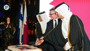 Minister of Labour H E Dr. Ali bin Smaikh Al Marri; Minister of Transport H E Sheikh Mohammed bin Abdullah bin Mohammed Al-Thani; and Ambassador of Finland to Qatar H E Juha Mustonen cut a cake to mark the occasion at an event in Doha yesterday. Pic: Mohamed Al Attar/ The Peninsula