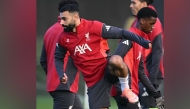 Liverpool’s Mohamed Salah (left) attends a team training session.