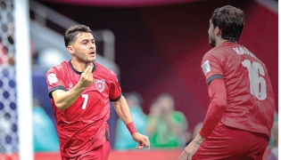 Jordan's Mohammad Abu Zraiq (left) celebrates after scoring a goal.