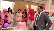 PISQ Principal Ch Muhammad Afzal along with staff and students during the event. 