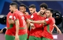 Morocco's Walid Azaro celebrates with teammates.