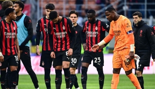 AC Milan's French goalkeeper #16 Mike Maignan(R) reacts at the end of the Italian Serie A football match between AC Milan and Sassuolo at the San Siro Stadium in Milan on December 14, 2025. (Photo by Piero CRUCIATTI / AFP)