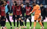 AC Milan's French goalkeeper #16 Mike Maignan(R) reacts at the end of the Italian Serie A football match between AC Milan and Sassuolo at the San Siro Stadium in Milan on December 14, 2025. (Photo by Piero CRUCIATTI / AFP)