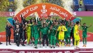 Saudi Arabia players and officials celebrate after winning the AGCFF U-23 Gulf Cup Qatar 2025 title yesterday.