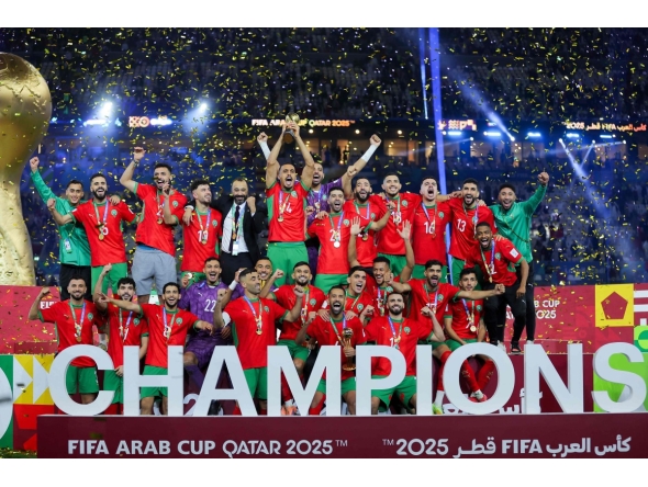 Morroco's players celebrate with the trophy after winning the FIFA Arab Cup 2025 final football match between Jordan and Morocco at the Lusail Stadium Stadium, in Lusail on December 18, 2025. (Photo by Karim JAAFAR / AFP)
