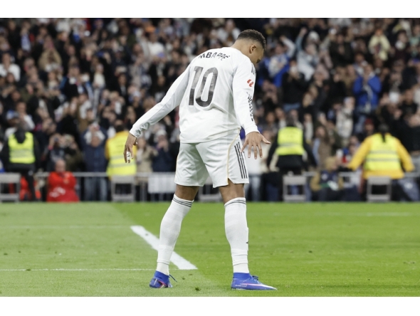 Real Madrid's French forward #10 Kylian Mbappe celebrates scoring his team's second goal at Santiago Bernabeu Stadium in Madrid on December 20, 2025. (Photo by Oscar Del Pozo / AFP)