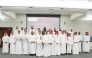 Ministry of Awqaf officials and the sponsored students.