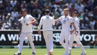 England’s Ben Stokes (second right) congratulates his teammates at the end of the innings during the second day at the Melbourne Cricket Ground. 