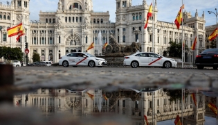 File: A picture taken on October 31, 2024 shows the Spanish flag flying at half-mast at the start of three days of national mourning after Spain's deadliest floods in decades, at Cibeles Square in Madrid. (Photo by Oscar Del Pozo / AFP)